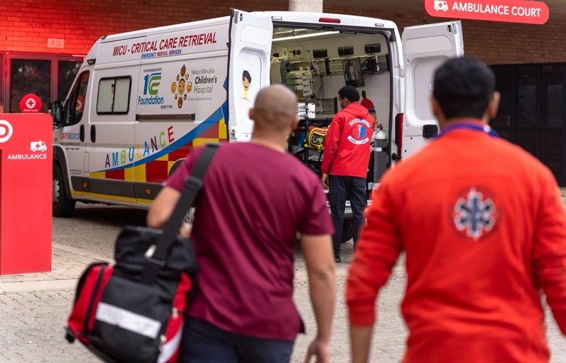 Medical team approaching the 1CC Foundation critical care ambulance at Nelson Mandela Children’s Hospital
